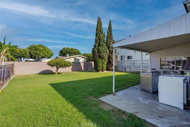 a view of a backyard with plants and a garden
