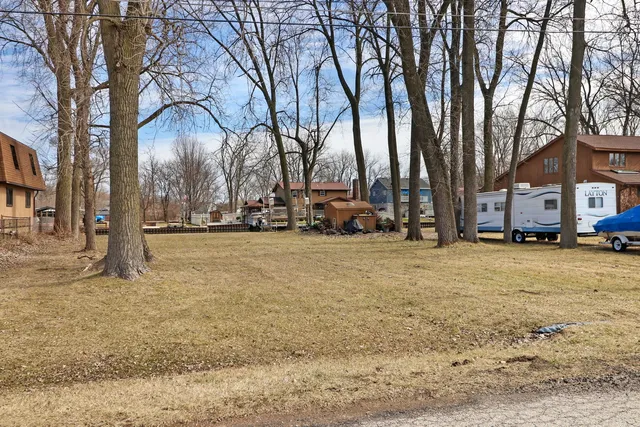 a view of street with parked cars