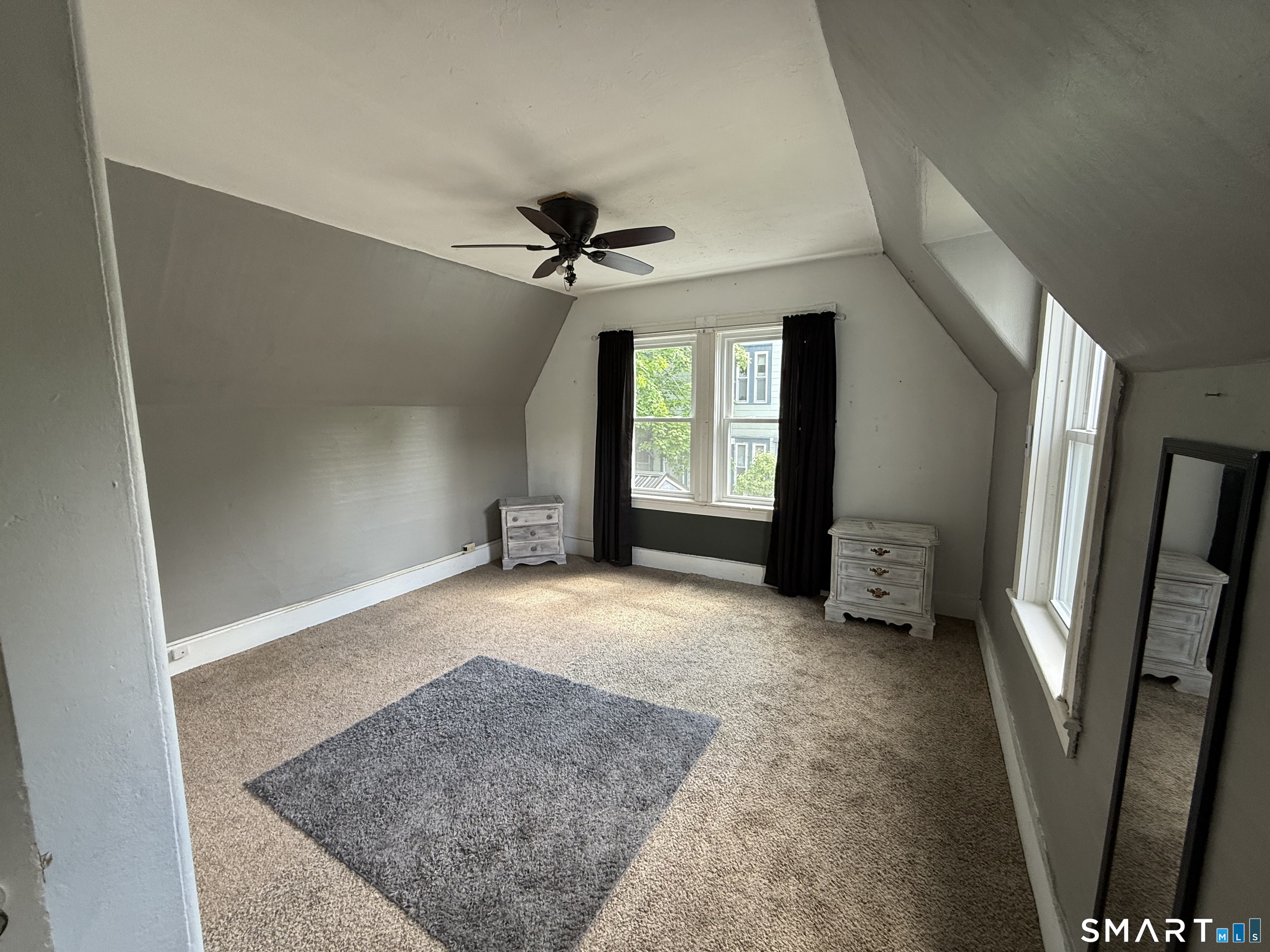 29 Florence Street Putnam, CT 06260 - Photo 11 of 17 an empty room with windows and cabinet