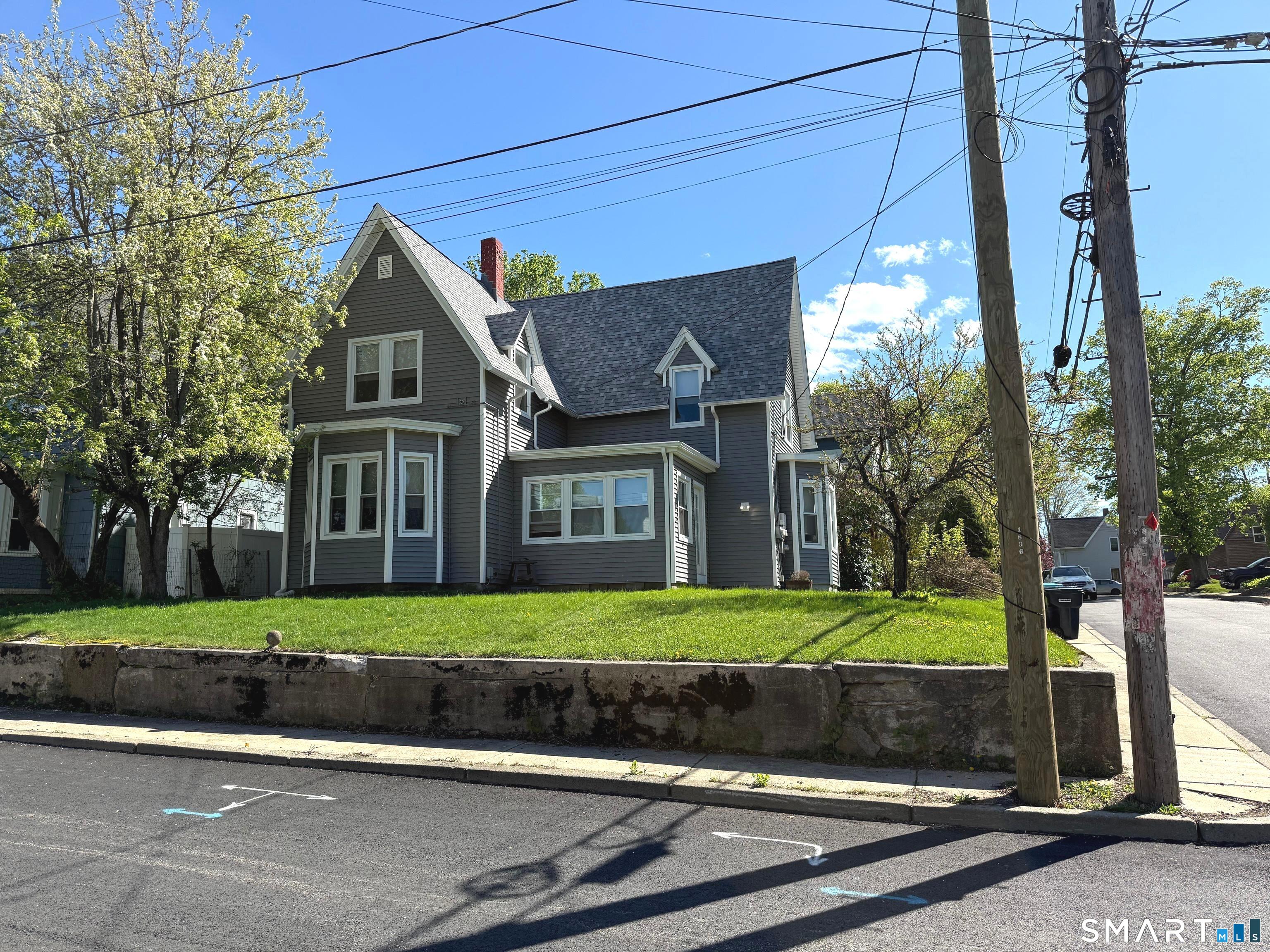 29 Florence Street Putnam, CT 06260 - Photo 2 of 17 a front view of a house with a yard