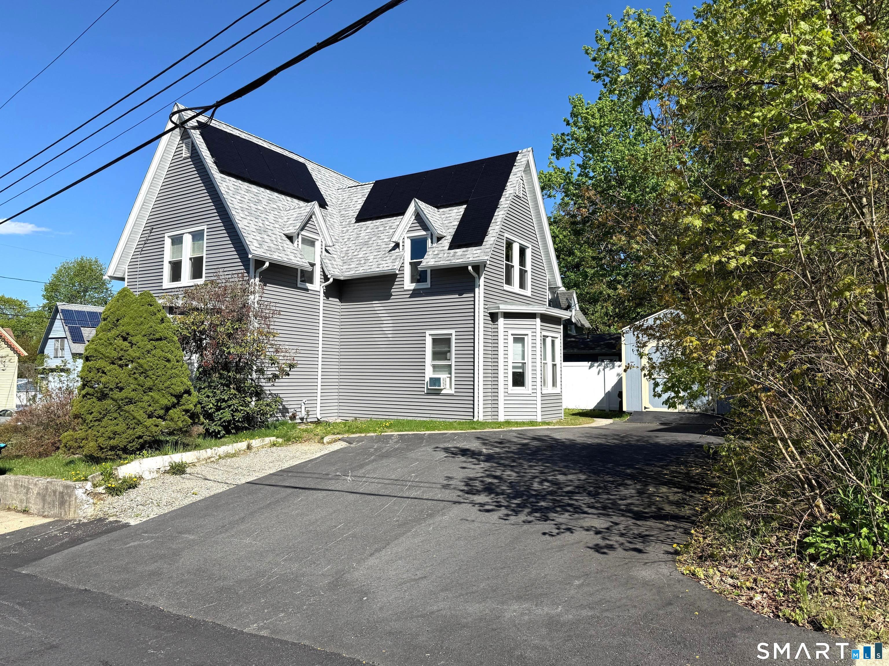 29 Florence Street Putnam, CT 06260 - Photo 3 of 17 a front view of a house with a yard