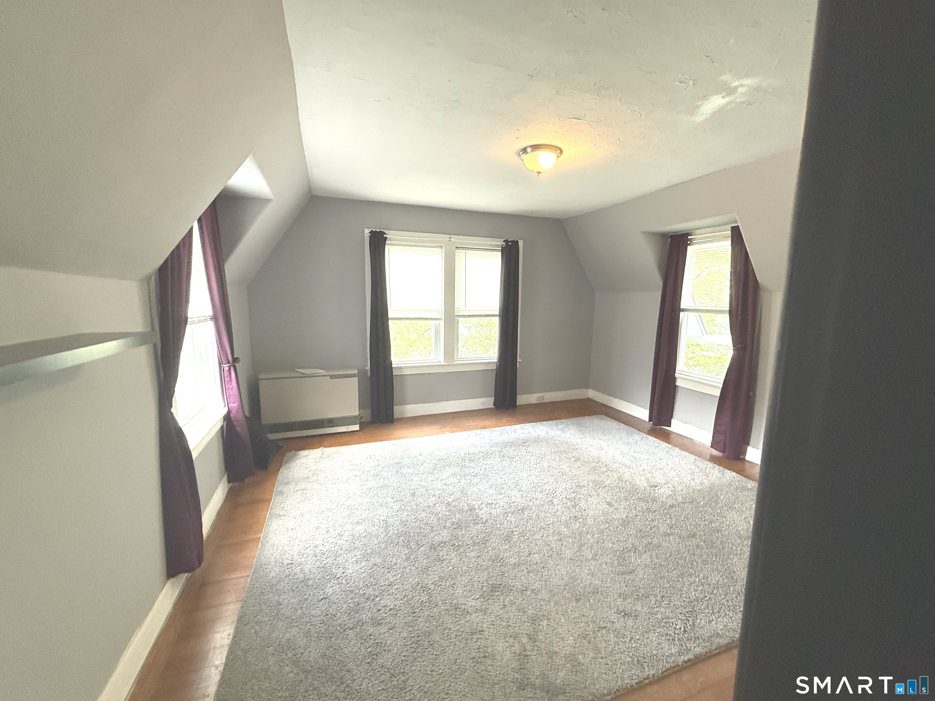 29 Florence Street Putnam, CT 06260 - Photo 6 of 17 an empty room with windows and entrance