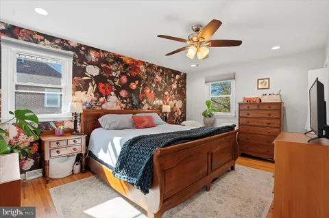 a bed room with a bed and a chandelier