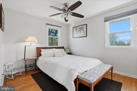 a bedroom with a bed and a table