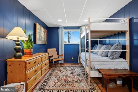 a bedroom with furniture and a window