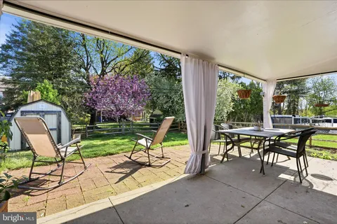 a view of a chairs and table in patio