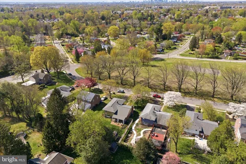 an aerial view of residential building and parking space