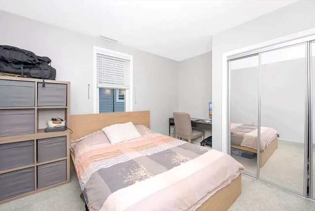 a living room with furniture and a book shelf