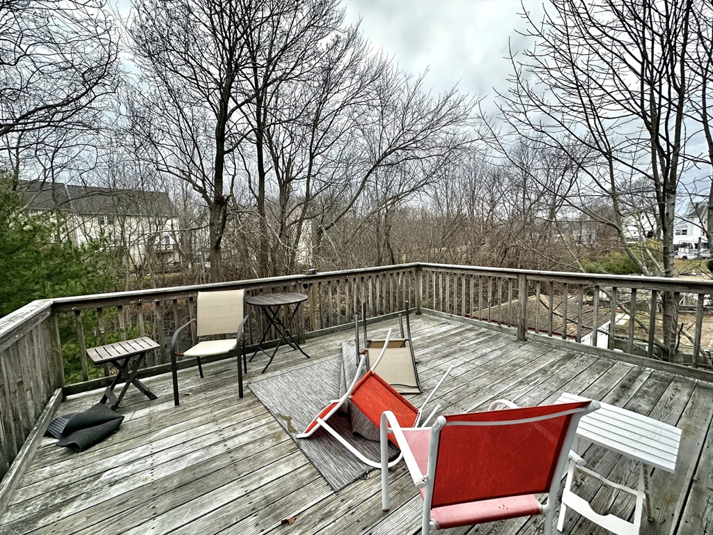 47-49 Botolph Street, Unit 49 Quincy, MA 02171 - Photo 14 of 14 a view of deck with furniture and trees