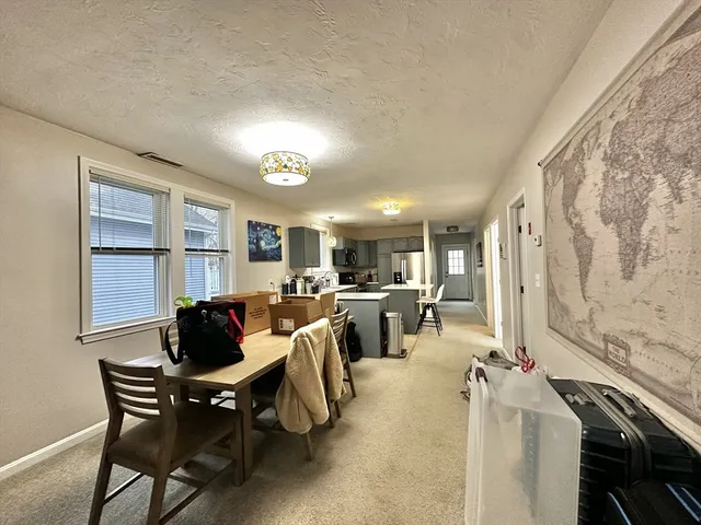 a kitchen with stainless steel appliances granite countertop a sink a stove and a refrigerator