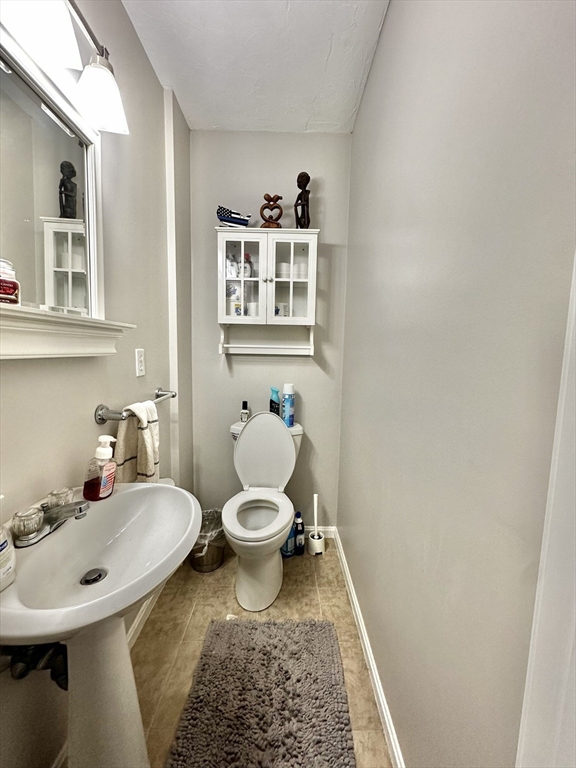 47-49 Botolph Street, Unit 49 Quincy, MA 02171 - Photo 8 of 14 a bathroom with a sink and a toilet