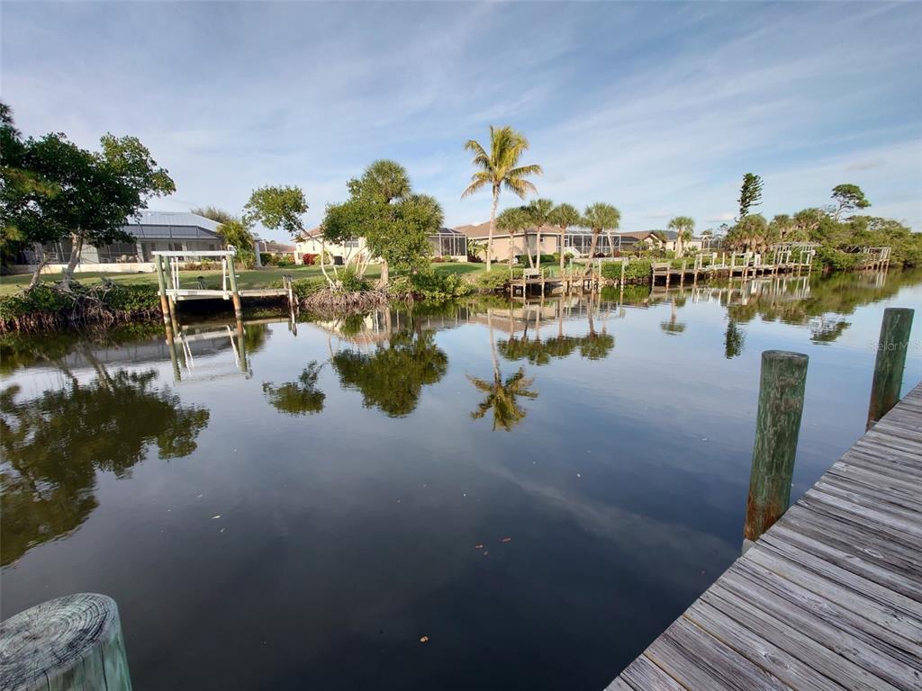 10071 Creekside Drive Placida, FL 33946 - Photo 15 of 16 a view of residential houses with outdoor space