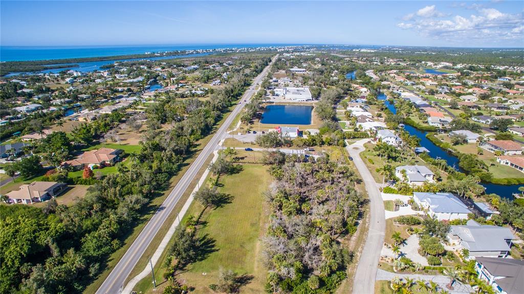 10071 Creekside Drive Placida, FL 33946 - Photo 7 of 16 an aerial view of residential houses with outdoor space
