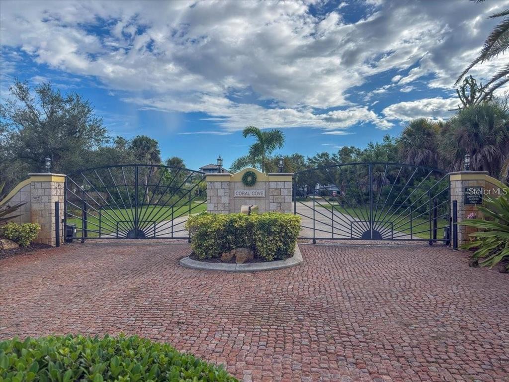 10071 Creekside Drive Placida, FL 33946 - Photo 10 of 16 a view of a garden with a building