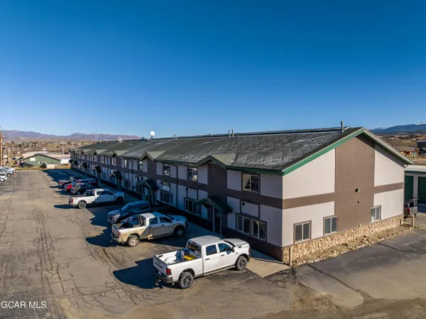 a view of a car park in front of house