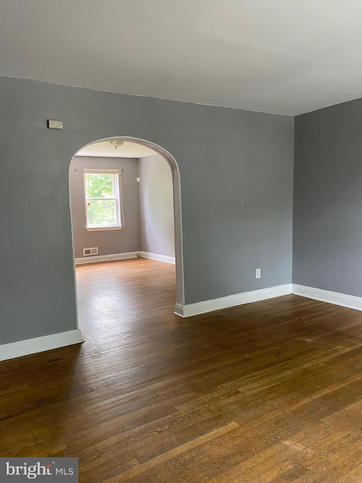 5757 Edgepark Road Baltimore, MD 21239 - Photo 8 of 44 a view of empty room with wooden floor