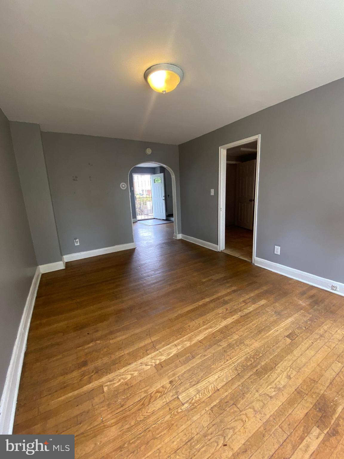 5757 Edgepark Road Baltimore, MD 21239 - Photo 9 of 44 a view of an empty room and window
