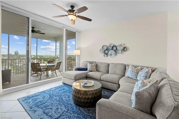 a living room with furniture and a rug