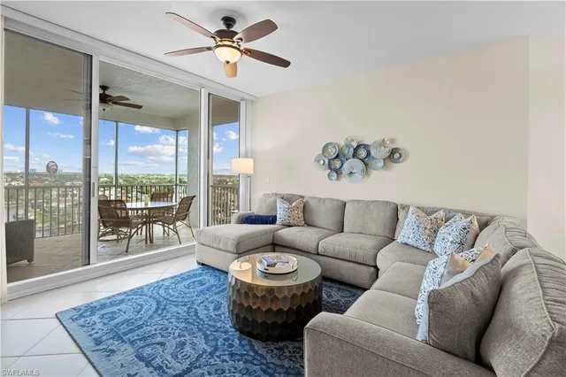 a living room with furniture and a rug