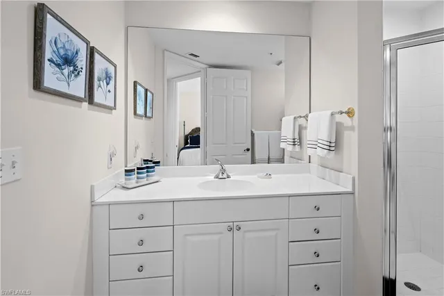 a bathroom with double sink and a mirror