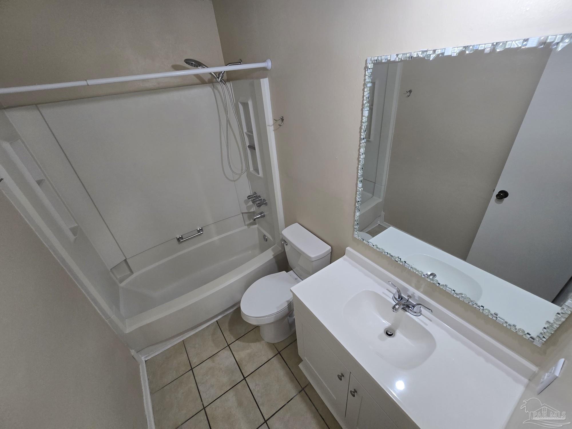 2303 West Michigan Avenue, Unit B10 Pensacola, FL 32526 - Photo 16 of 25 a bathroom with a sink a toilet and shower