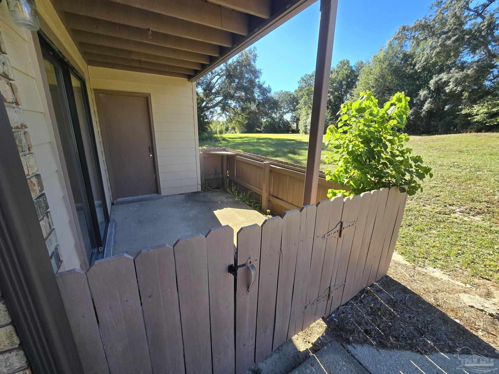 2303 West Michigan Avenue, Unit B10 Pensacola, FL 32526 - Photo 18 of 25 a view of balcony with wooden floor