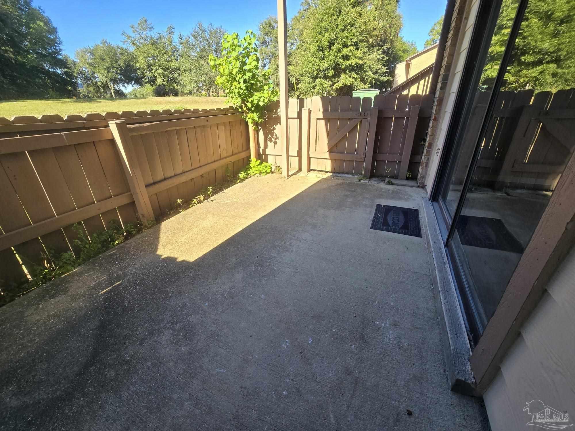 2303 West Michigan Avenue, Unit B10 Pensacola, FL 32526 - Photo 21 of 25 a view of a backyard with jacuzzi