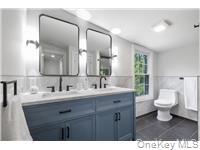 78 Main Street Tappan, NY 10983 - Photo 11 of 25 a bathroom with a sink and a mirror