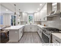 78 Main Street Tappan, NY 10983 - Photo 6 of 25 a kitchen with stainless steel appliances granite countertop a sink stove and refrigerator