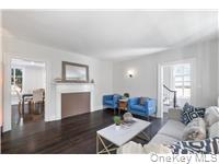 78 Main Street Tappan, NY 10983 - Photo 9 of 25 a living room with furniture wooden floor and a fireplace