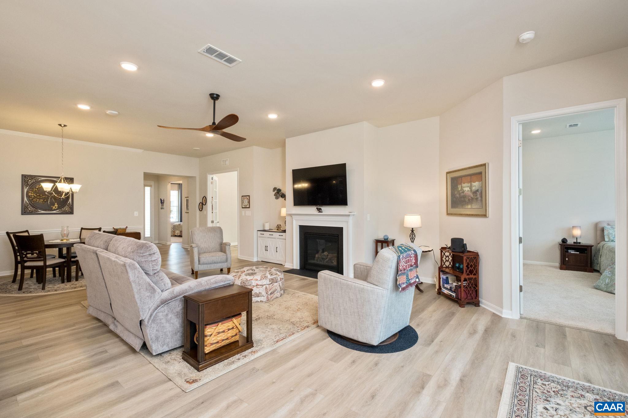 124 Stodghill Drive Ruckersville, VA 22968 - Photo 27 of 58 a living room with fireplace furniture and a flat screen tv