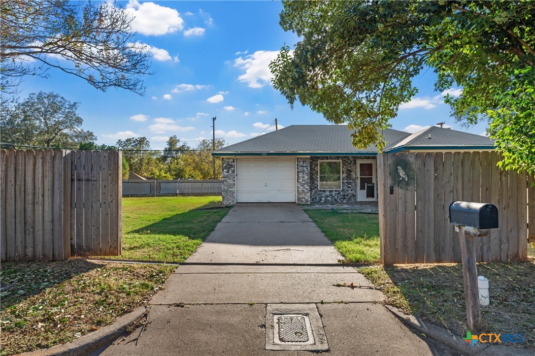 1101 East Walnut Street Waco, TX 76704 - Photo 1 of 17 a front view of a house with garden