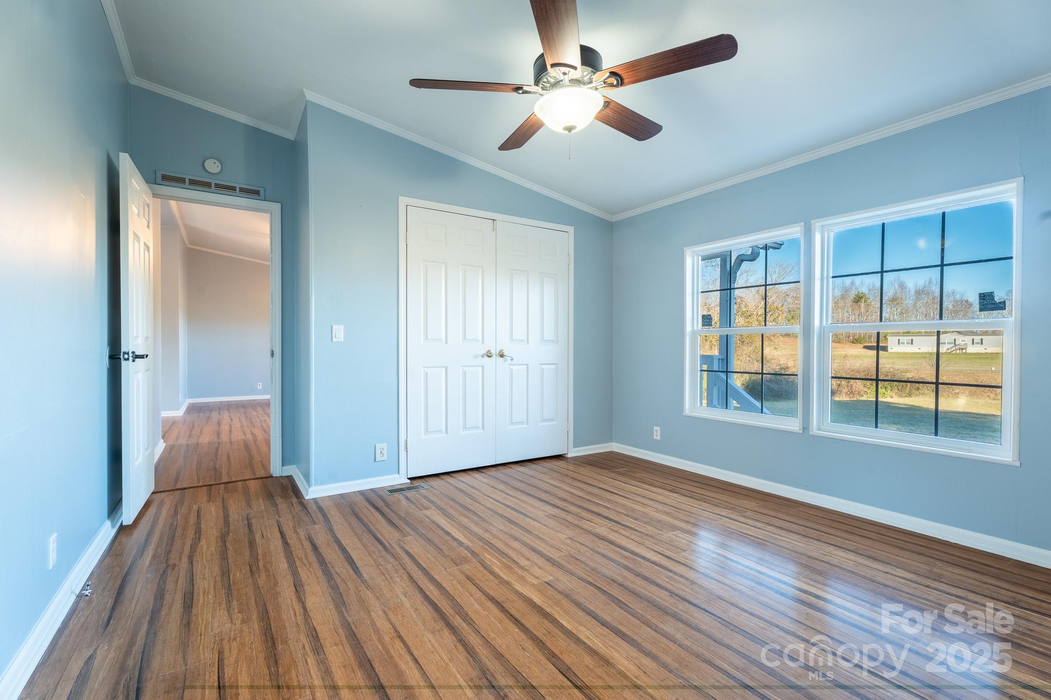 964 Lavender Road Grover, NC 28073 - Photo 11 of 26 a view of empty room with wooden floor and fan