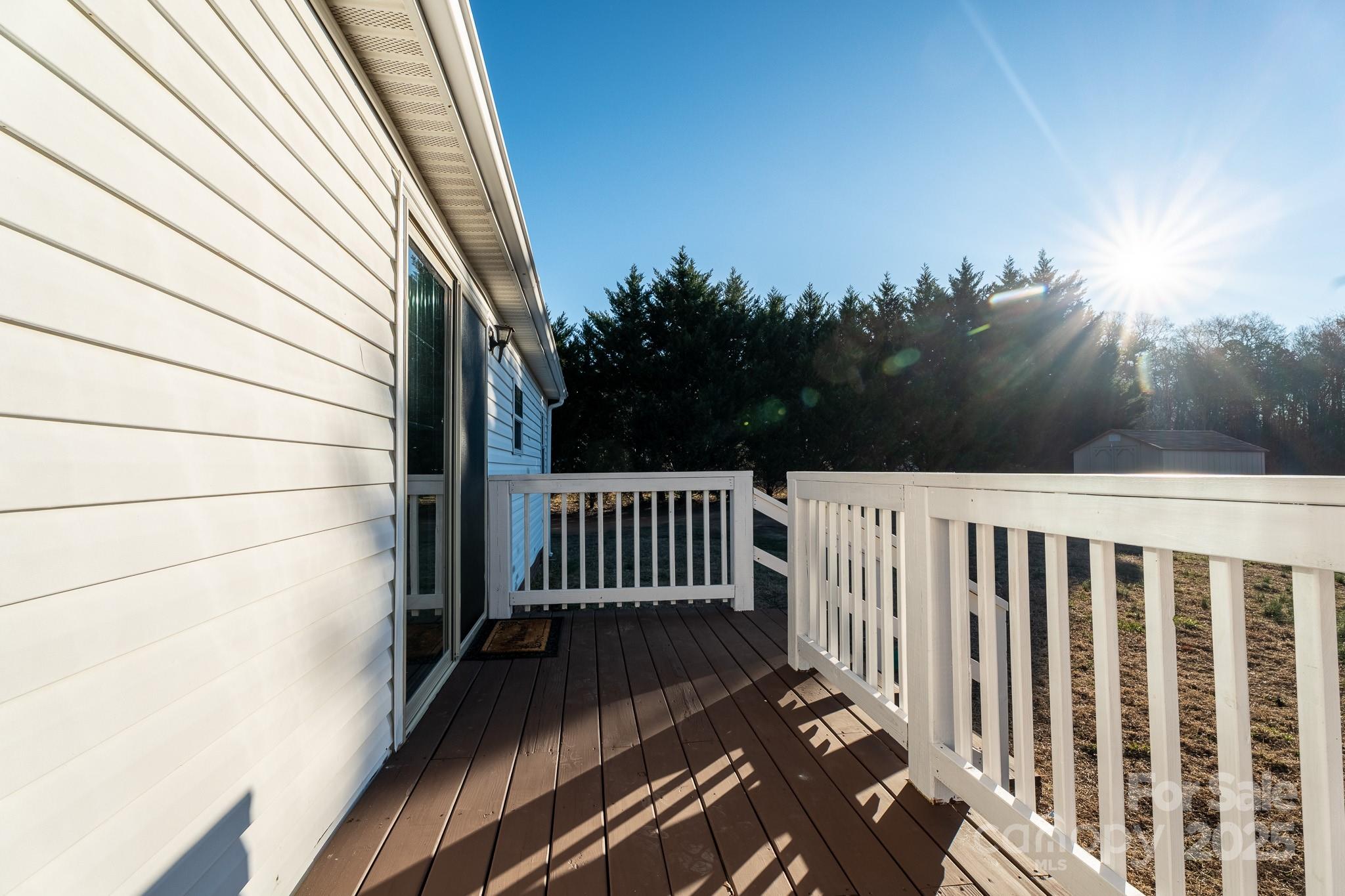 964 Lavender Road Grover, NC 28073 - Photo 21 of 26 a view of a balcony with wooden floor and fence