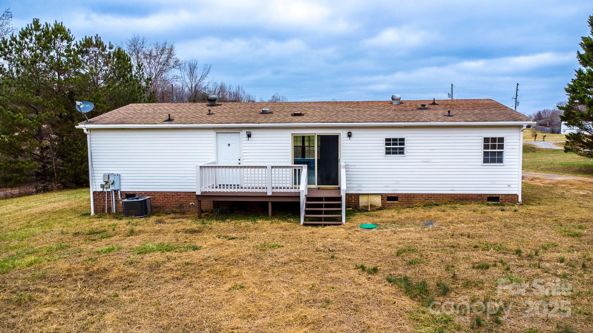 964 Lavender Road Grover, NC 28073 - Photo 23 of 26 a view of a house with a yard and sitting area