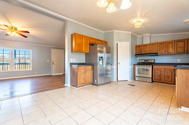 a view of a kitchen with a sink and cabinets