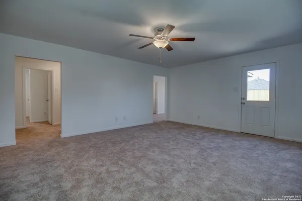 a view of an empty room with a window