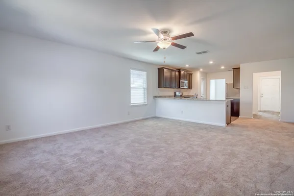 a view of a kitchen with a sink and cabinet area