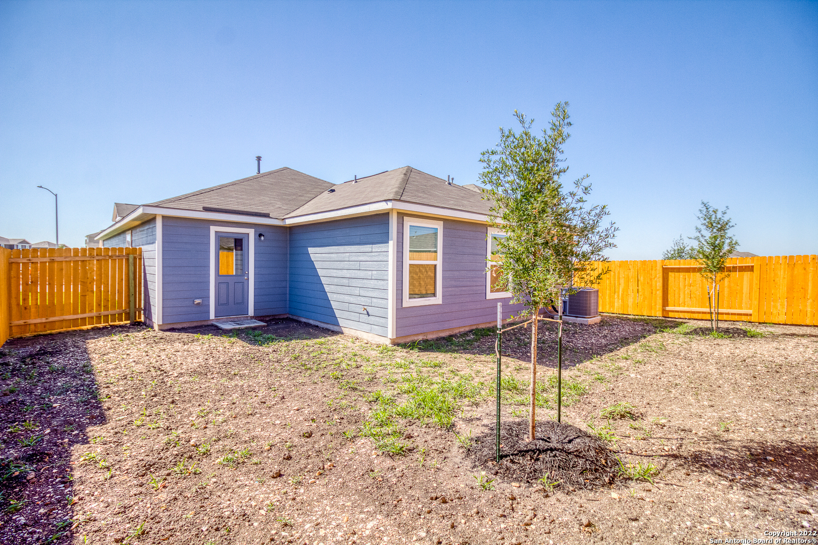 3055 Jackson Summit Converse, TX 78109 - Photo 2 of 31 a backyard of a house with table and chairs