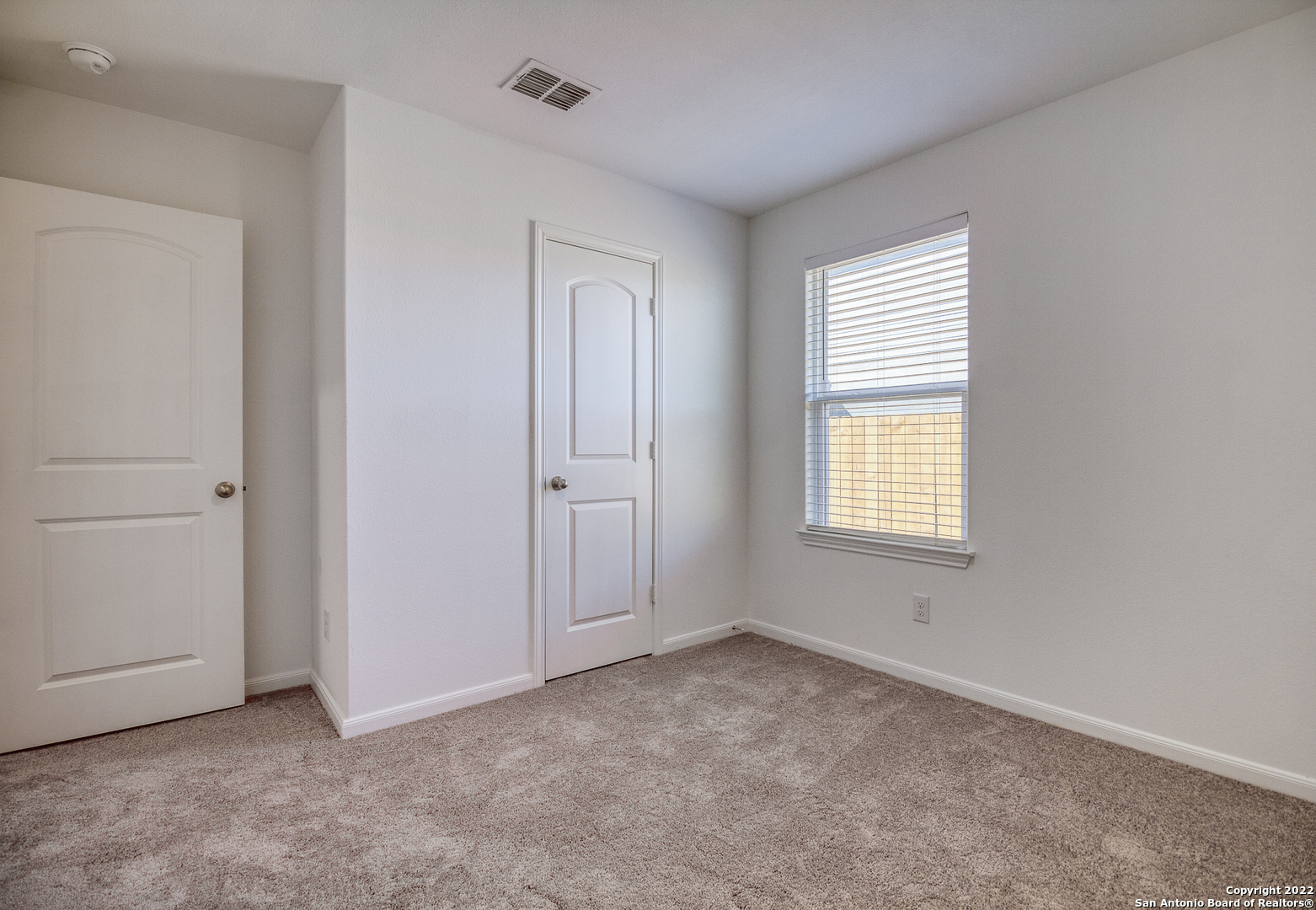 3055 Jackson Summit Converse, TX 78109 - Photo 22 of 31 an empty room with windows