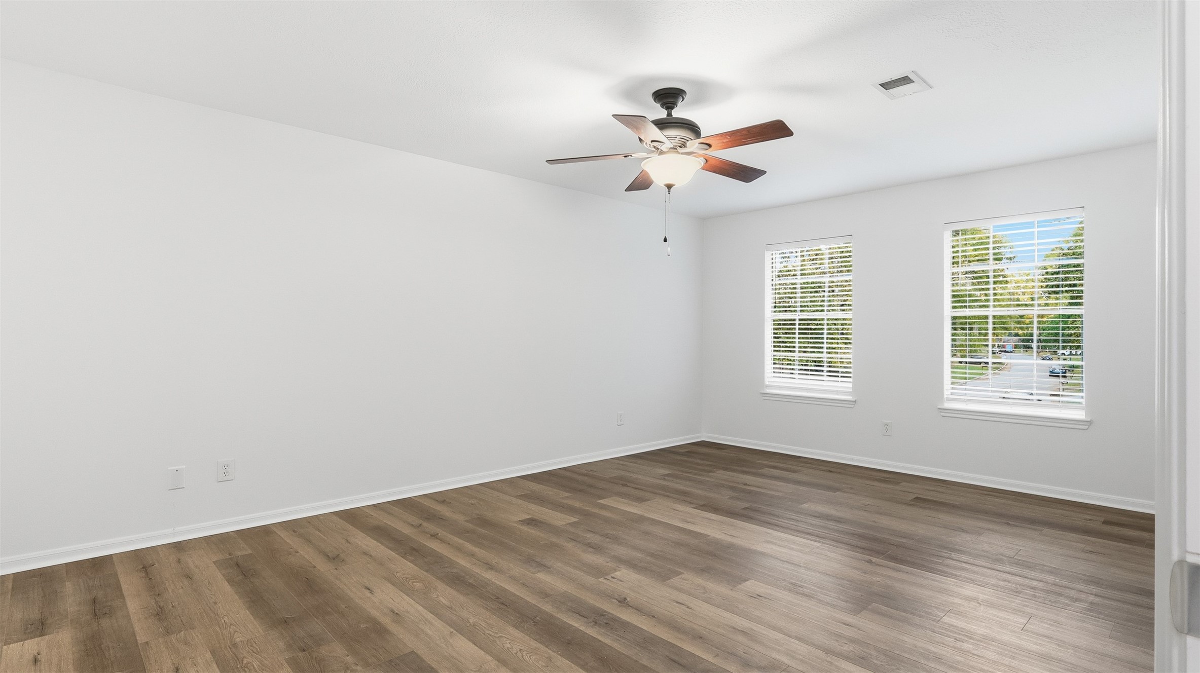 2715 Wild Ridge Drive Kingwood, TX 77339 - Photo 18 of 32 wooden floor in an empty room with a window
