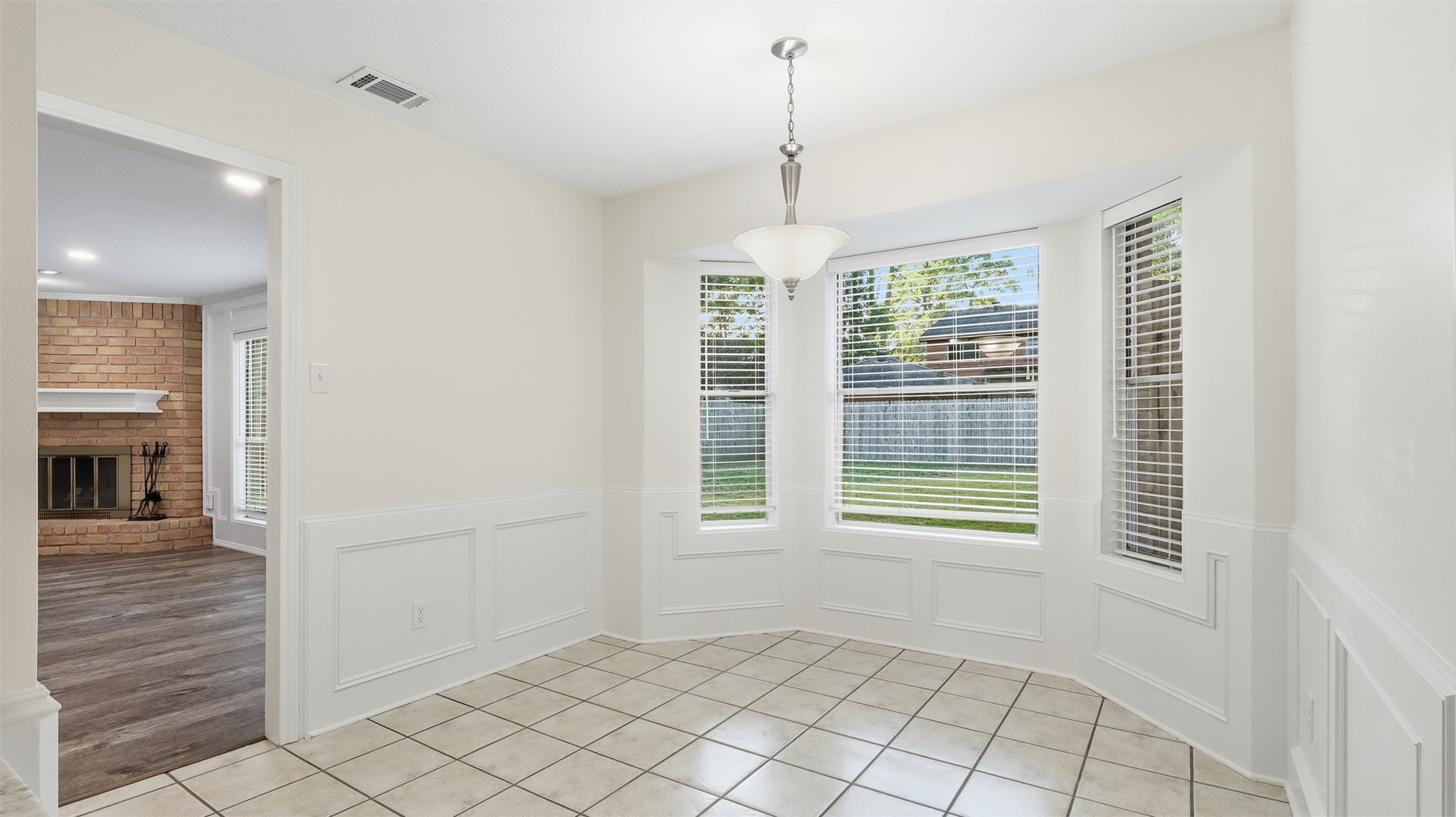 2715 Wild Ridge Drive Kingwood, TX 77339 - Photo 5 of 32 a view of an empty room with window and cabinet