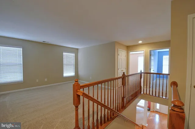 a view of a hallway with windows