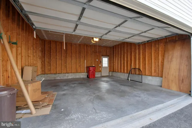a view of a room with wooden walls and stairs