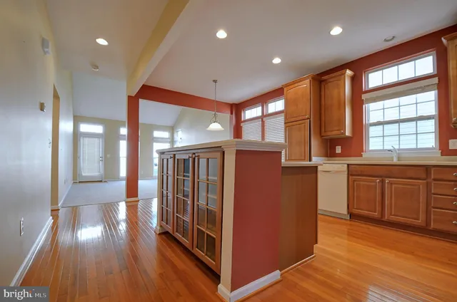 a view of kitchen with furniture and wooden floor