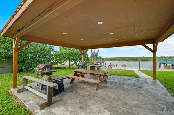 a backyard of a house with outdoor seating