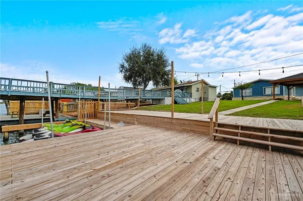 a view of swimming pool with seating space and hardwood floor