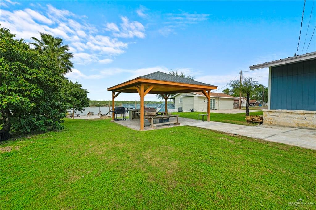 37443 Marshall Hutts Road Rio Hondo, TX 78583 - Photo 15 of 15 a view of pool with umbrella and trees