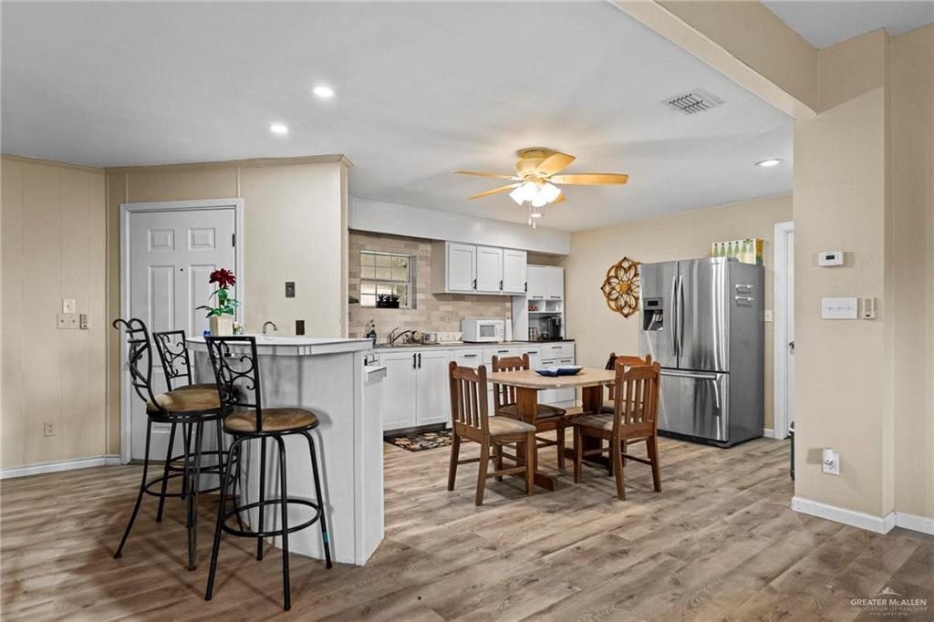 37443 Marshall Hutts Road Rio Hondo, TX 78583 - Photo 4 of 15 a view of a dining room with furniture and chandelier
