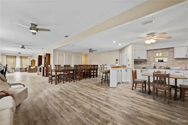 a living room with lots of furniture and white walls